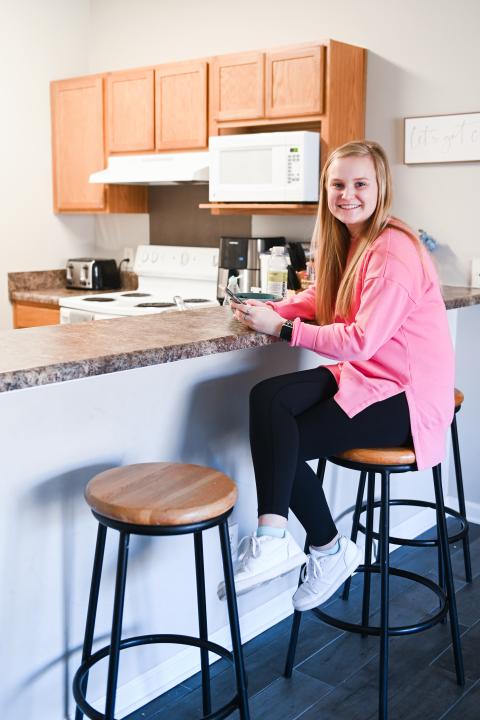 girl sitting on barstool in a decosimo apartment