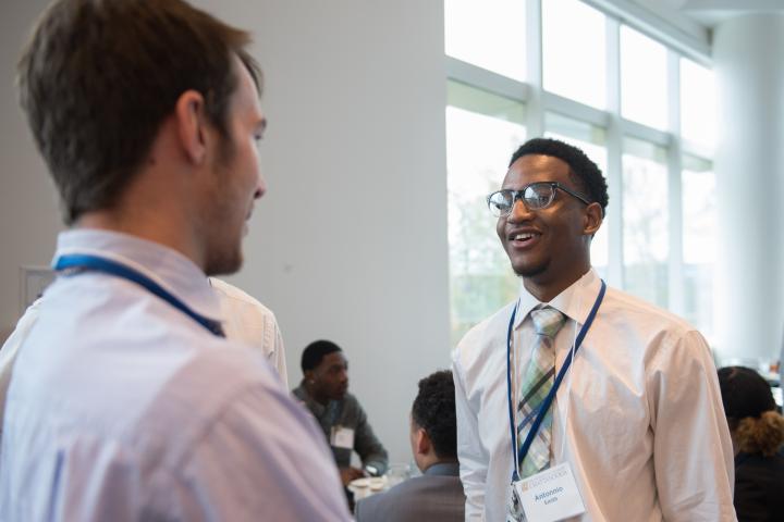 Students talking at an event
