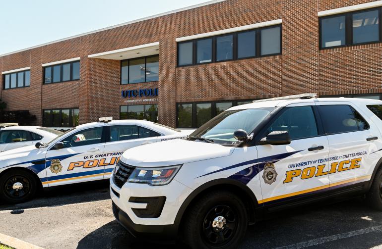 UTC PD cars parked in front of the Administrative Services building.