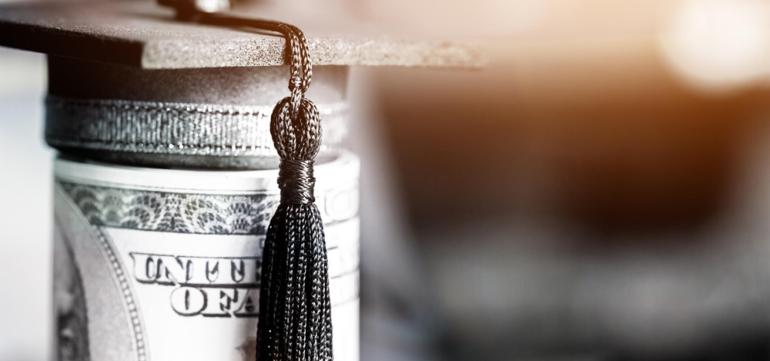 URaCE funding image: A roll of dollars with a graduation cap on top.