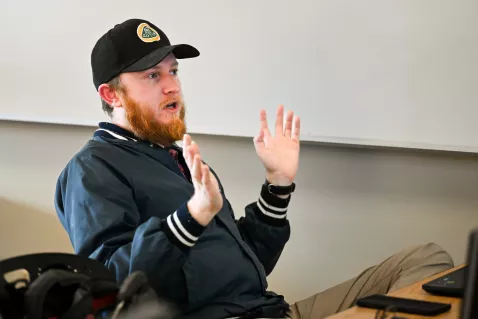 UTC computer engineering student holding up his hands