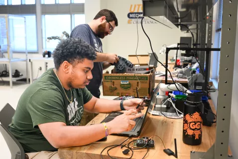 UTC Mechatronics students working with wiring in a lab